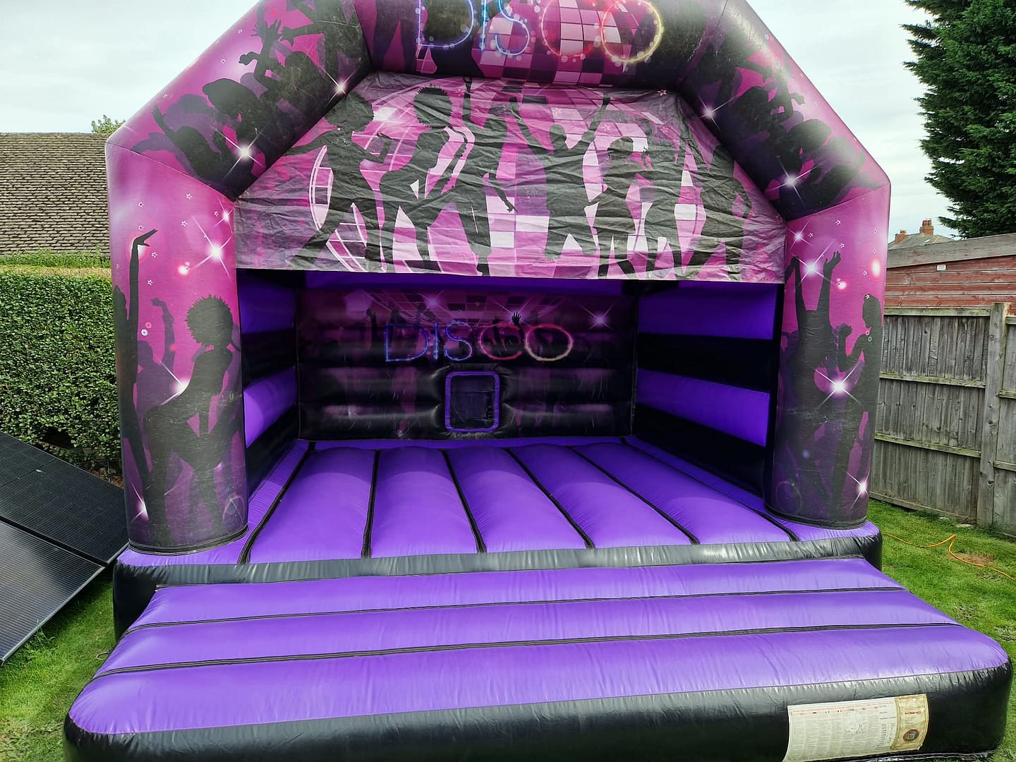 Purple & Black Disco-Themed Adult Bouncy Castle