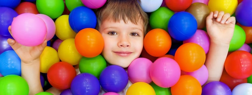 Colourful ball pool and air juggler setup for children's parties, offering safe and interactive play.