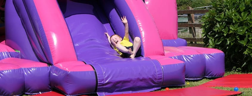 Bounce n Slide Castle featuring a slide, perfect for fun-filled events.